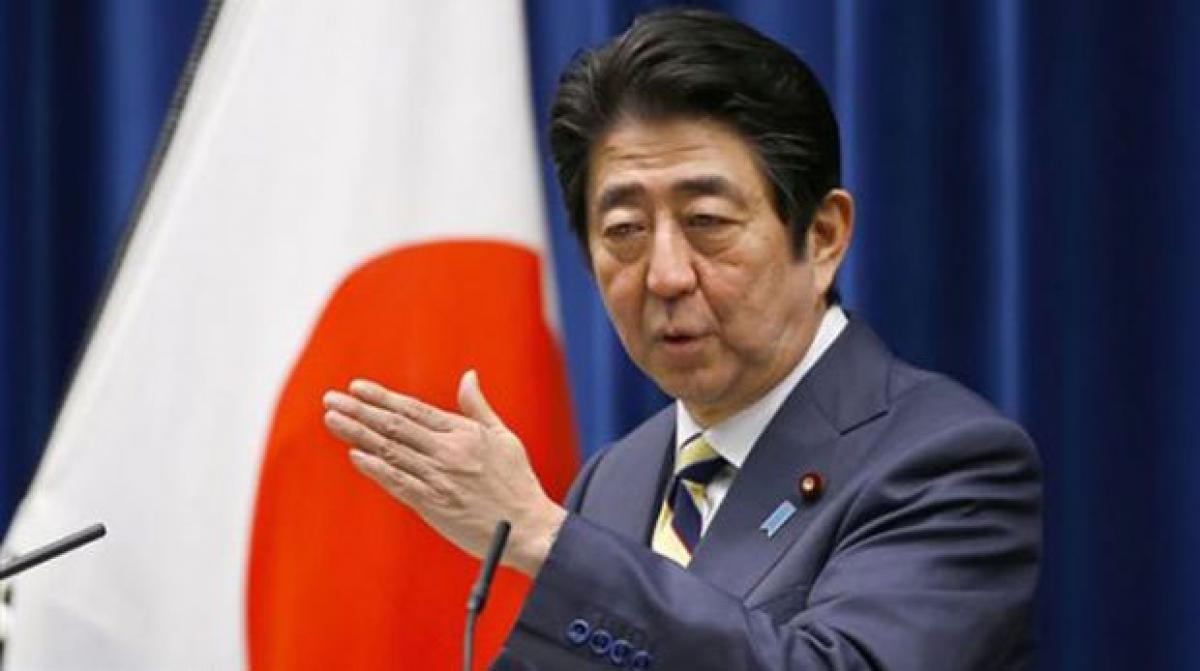 Shinzo Abe says summit with Putin needed to resolve territorial row